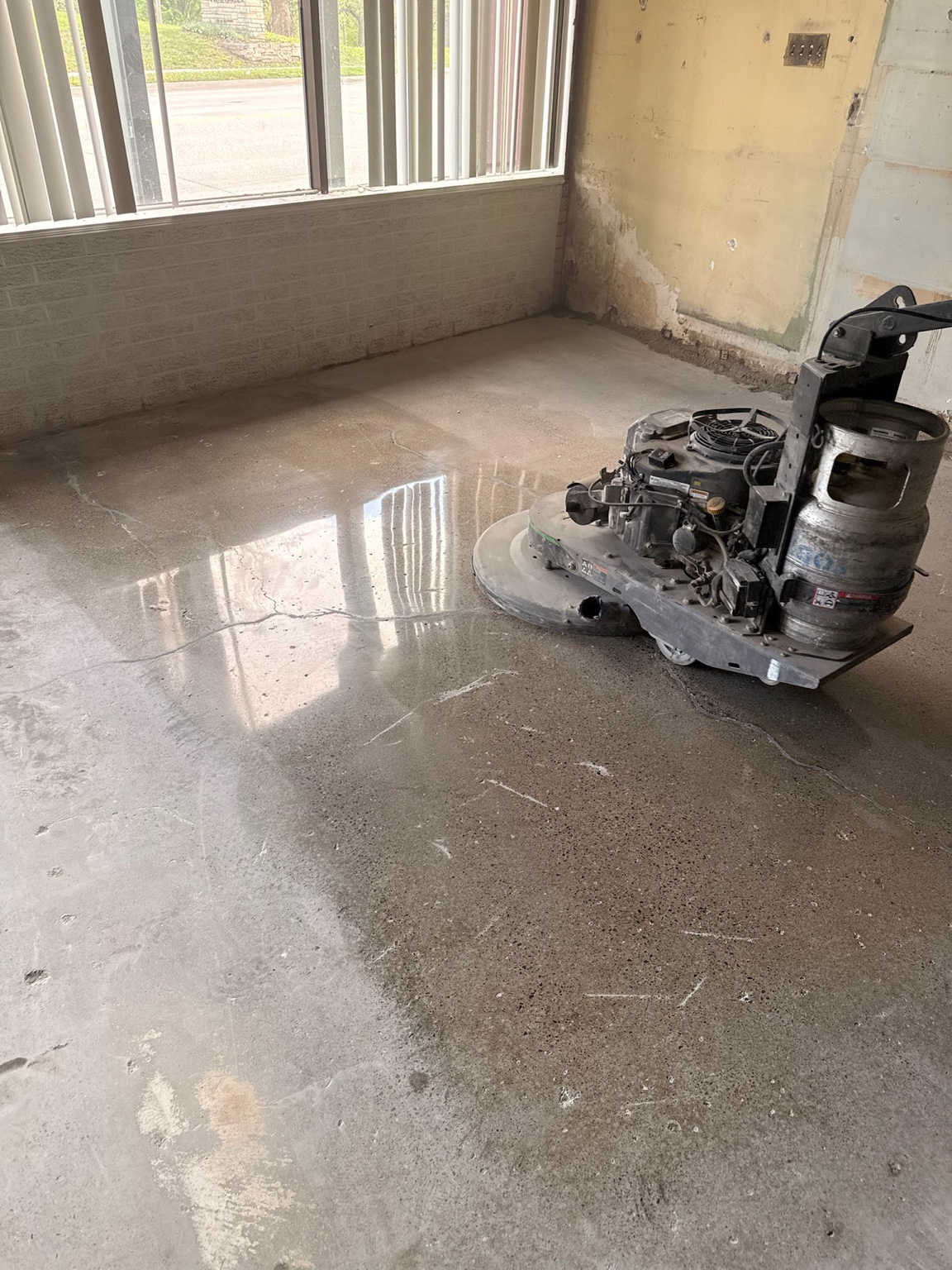 Concrete polishing machine on a commercial floor in Des Moines
